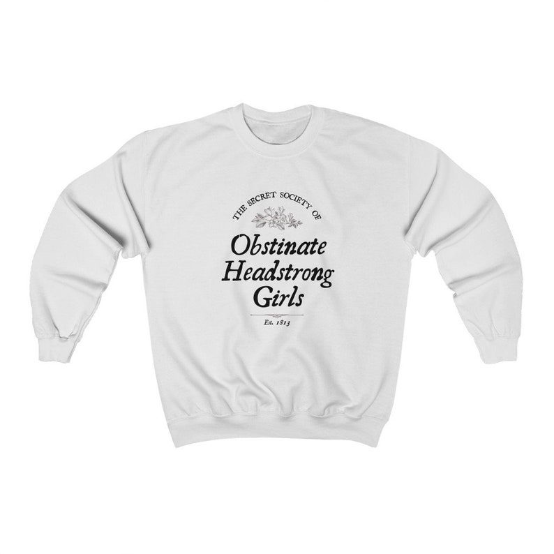 May include: White sweatshirt with a black graphic print that reads "The Secret Society of Obstinate Headstrong Girls Est. 1913"