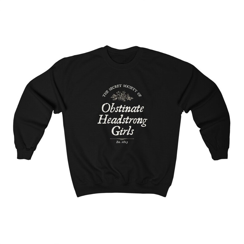 May include: Black sweatshirt with a white graphic print that reads "The Secret Society of Obstinate Headstrong Girls Est. 1913".