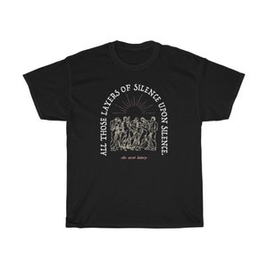 May include: Black t-shirt with a white graphic print of a group of people standing in a circle with the text "All those layers of silence upon silence -the secret history- "