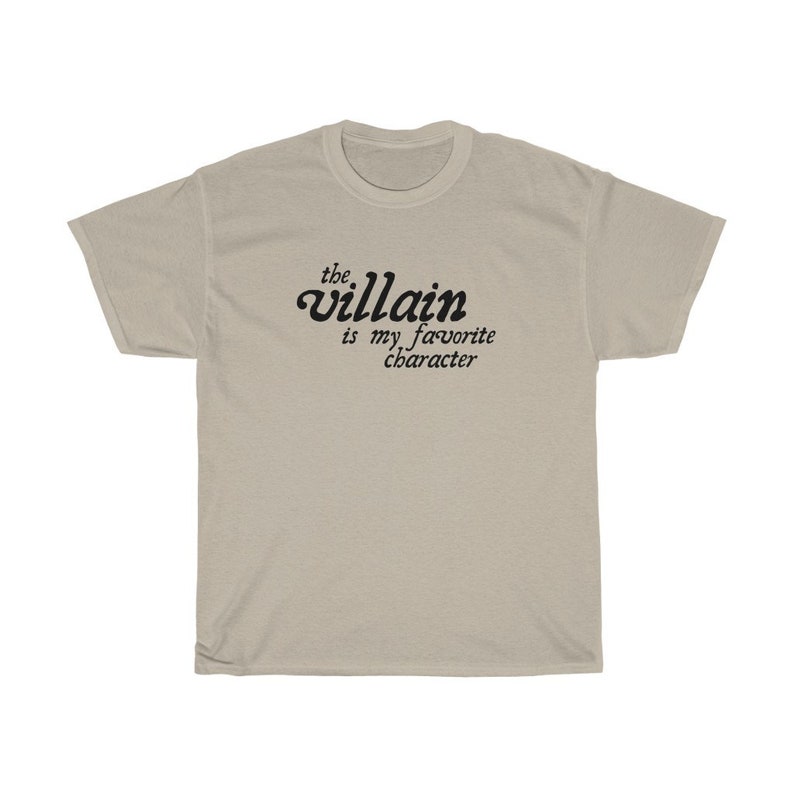 May include: A beige t-shirt with the text "the villain is my favorite character" printed in black.