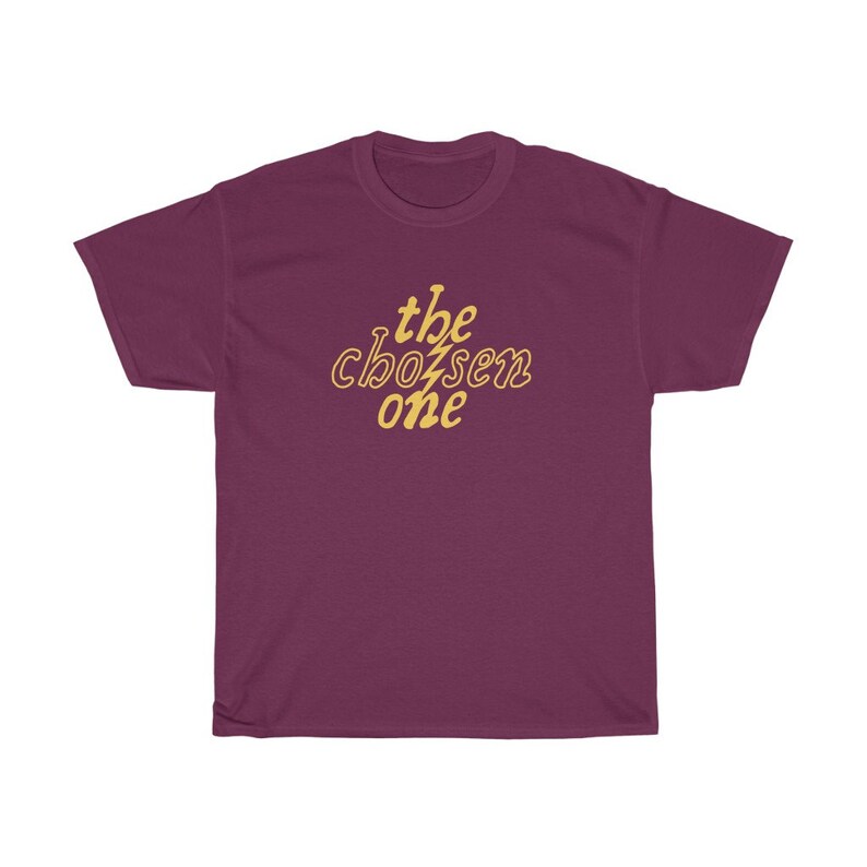 May include: Burgundy t-shirt with the text "the chosen one" in yellow.
