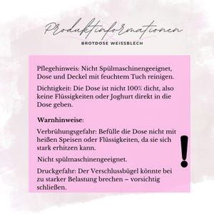 May include: A pink rectangular card with black text providing product information for a bread box. The text includes care instructions, warnings about liquids, and a caution about the closure. An exclamation point is also visible.