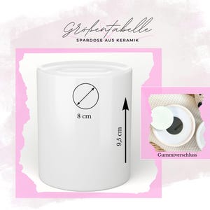May include: A white ceramic cylinder-shaped piggy bank. The bank is 3.1 inches in diameter and 3.7 inches tall. The text on the image reads "Gr&ouml;&szlig;entabelle" and "Spardose aus Keramik".