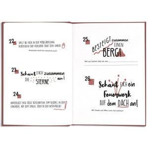 May include: Open notebook pages with German text and illustrations. One page has text about playing hide-and-seek at IKEA. Another page has text about climbing a mountain and watching fireworks.