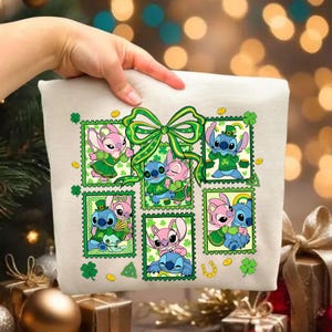 May include: A cream cushion featuring a St. Patrick's Day design with cartoon characters in green outfits. The design includes shamrocks, gold coins, and a green bow.