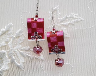 May include: A pair of pink and white checkered earrings with silver accents and pink crystal drops.
