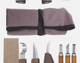 May include: A wood carving set with various tools, including knives and chisels, alongside a pair of gray work gloves and a green sharpening block. The tools have wooden handles and silver blades, and are stored in a rolled-up purple fabric case.