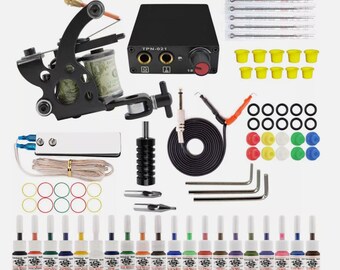 May include: A complete black tattoo machine kit with various components. Includes a black tattoo machine, power supply, ink bottles, needles, and other accessories. The kit features a variety of colored inks and essential tools for tattooing.