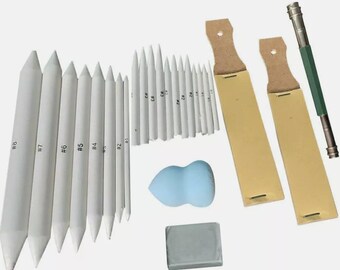 May include: A collection of art supplies, including blending stumps labeled #1 through #8, paper blending stumps, a blue teardrop-shaped sponge, a gray eraser, two leather-handled tools, and a green and silver pencil holder.
