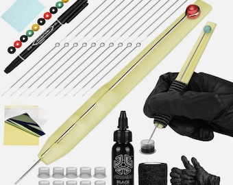 May include: A collection of tattoo supplies, including a black marker, needles, ink, and a tattoo pen. The image also shows ink caps, a roll of black grip tape, and a pair of black gloves.