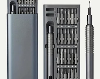 May include: A gray screwdriver set with multiple bits and a magnetic handle. The set includes a storage case and a separate screwdriver handle. The bits are organized in rows within the case, and the handle has a textured grip.