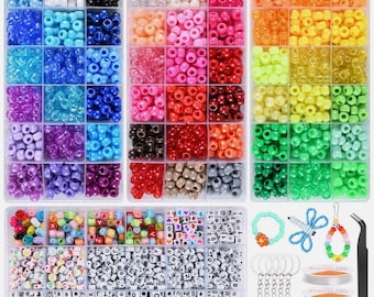 May include: A craft kit with various colorful beads in organized compartments. Includes round, letter, and number beads, along with jewelry-making supplies like keychains, string, and tweezers. The beads are in shades of blue, pink, orange, green, and more.