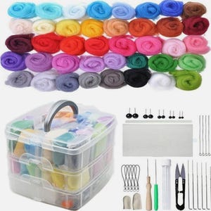 May include: A craft kit featuring a selection of colourful wool roving, a clear plastic storage container, and various tools. The wool roving is arranged in rows of blues, greens, yellows, reds, pinks, purples, grays, and black. The kit includes needles, scissors, and finger protectors.