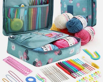 May include: A light blue crochet kit with a floral pattern, open to reveal various crochet tools, including colorful crochet hooks, yarn, and stitch markers. A matching bag is also visible, along with several balls of yarn in various colors. A ruler and stitch holders are also included.
