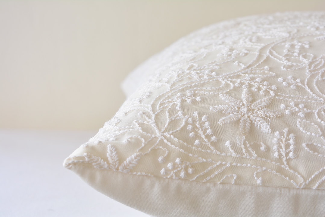 white embroidered throw pillows