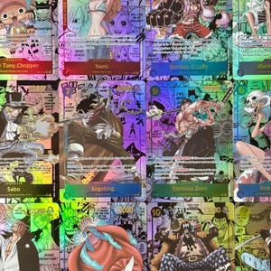 May include: A collection of twelve One Piece trading cards featuring colorful manga-style illustrations of characters including Tony Chopper, Nami, Monkey D. Luffy, Sabo, Sogeking, Roronoa Zoro, Boa, Shanks, Buggy, and Marshall D. Teach with text.