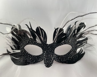 Cruella DeVille De Vil mask with layered feather work and black rhinestones.