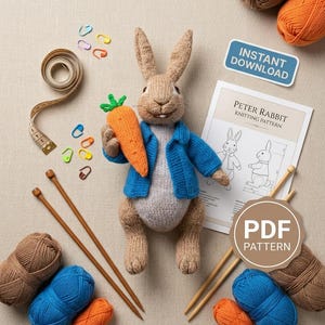 May include: A knitted Peter Rabbit doll in a blue jacket holding an orange carrot, surrounded by brown and blue yarn balls, wooden knitting needles, a measuring tape, colorful stitch markers, and a printed knitting pattern labeled INSTANT DOWNLOAD.