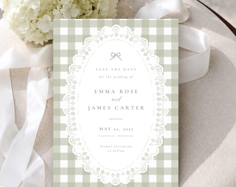 May include: A rectangular Save the Date card featuring a sage green and white gingham pattern. The center displays an oval white lace frame containing a small bow icon and the text: Save the date for the wedding of Emma Rose and James Carter, May 22, 2027, Nashville, Tennessee, formal invitation to follow.