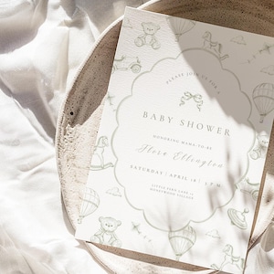 May include: A baby shower invitation with a scalloped edge, decorated with pale green illustrations of toys such as teddy bears and rocking horses. The invitation text includes "Baby Shower", the honoree's name, date, time, and location.