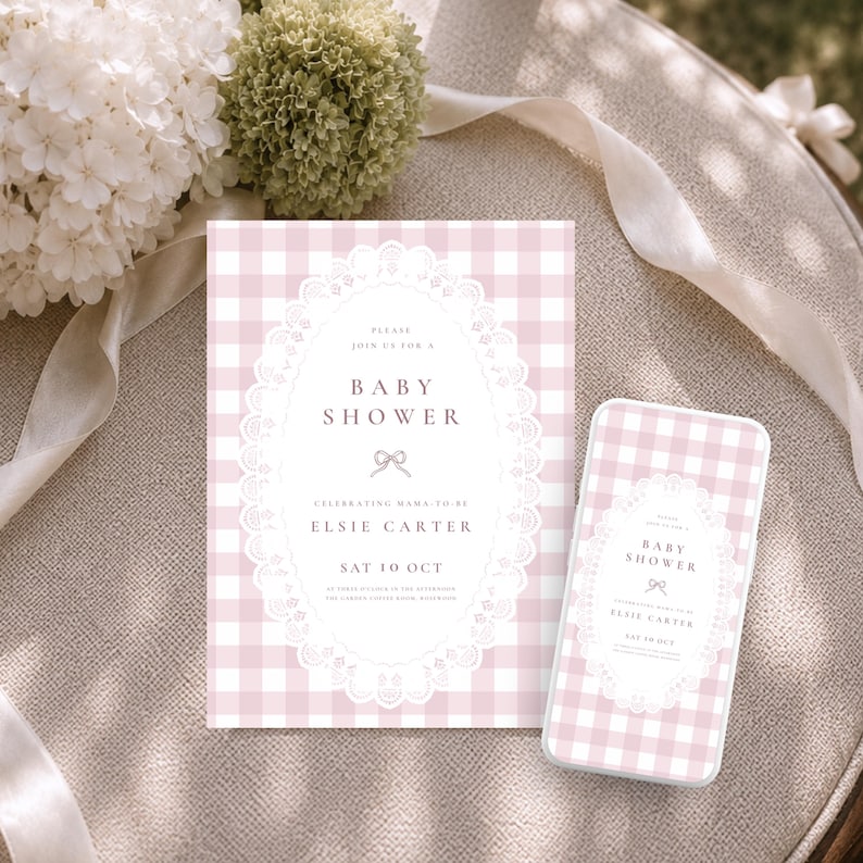 May include: A rectangular baby shower invitation and a matching smartphone screen display, both featuring a light pink and white gingham pattern with a central white oval frame decorated with lace-like edges and text reading Baby Shower.
