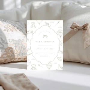May include: A baby shower invitation in a soft, neutral colour scheme, with a scalloped border. The design incorporates illustrations of teddy bears, hot air balloons, and rocking horses. The text reads "Baby Shower" and event details.