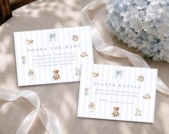 May include: Two rectangular cards with light blue vertical stripes and watercolor illustrations of a teddy bear, toy airplane, blocks, and bow. One card reads BOOKS FOR BABY, the other DIAPER RAFFLE with text instructions and a line for a name.