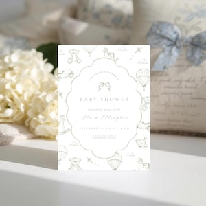 May include: A baby shower invitation with a scalloped edge, decorated with drawings of hot air balloons, teddy bears, and toy cars. The text reads "Baby Shower" and includes the honoree's name and event details. The invitation is in soft green and white.