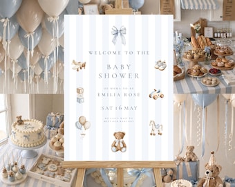 May include: A baby shower scene with a sign that reads "Welcome to the Baby Shower of Mama-to-be Emilia Rose Sat 16 May". The decor includes blue and white balloons, a cake, teddy bears, and various pastries.