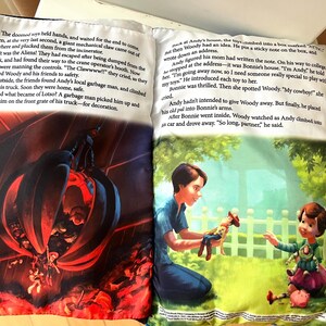 May include: An open storybook featuring two pages of text and illustrations. The left page shows a dark scene with a mechanical claw over a pile of toys. The right page depicts a person handing a cowboy doll to a child in a green outdoor setting.