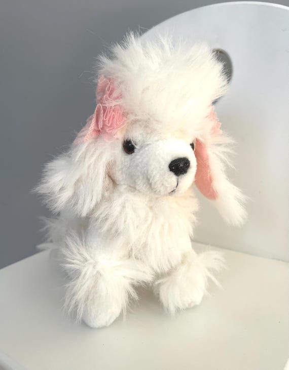 ふわふわのプードルのぬいぐるみ 23 cm/ピンクの耳とリボンが付いた