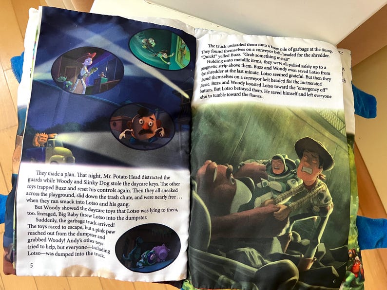 May include: A children's storybook open to pages five and six, featuring colorful illustrations of Toy Story characters including Woody, Buzz Lightyear, and Mr. Potato Head. The pages contain printed English text narrating a scene at a garbage dump.