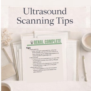 May include: A stack of white papers with the title "Ultrasound Scanning Tips" in dark blue. One paper reads "RENAL COMPLETE" with medical tips about pyelonephritis, renal stones, and pelvic dilation. A pen and a cup are on the right.