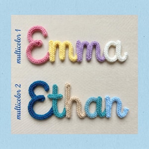 May include: Two crocheted names, "Emma" and "Ethan", in a variety of colors. "Emma" is in pink, yellow, purple, and white. "Ethan" is in blue, teal, beige, and light blue. The names are displayed on a light background with a blue border.
