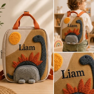 May include: A tan and beige backpack featuring a textured, dark gray dinosaur appliqu&eacute; with orange spikes, a yellow sun, and the embroidered name Liam. The bag includes orange top handles, adjustable shoulder straps, and a zippered front pocket.