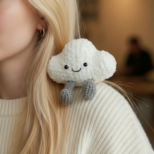 May include: A white ceramic mug with a black handle and the text "But First, Coffee" in a handwritten style. The mug is on a white surface. The mug is likely for hot beverages.