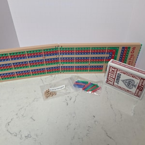 Compact Folding Cribbage Set with Peg Storage With a deck of cards