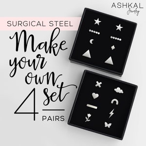Könnte beinhalten: Vier Sets Ohrringe aus chirurgischem Stahl in schwarzen Boxen. Jedes Set hat ein anderes Design, darunter Sterne, Monde, Dreiecke, Herzen, Wolken, Regenbögen, Blumen und Schmetterlinge. Der Text "Make your own 4 set pairs" ist auf einem rosa Hintergrund gedruckt.