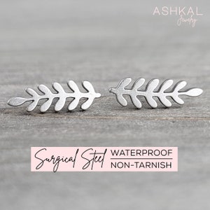 May include: A pair of silver leaf-shaped earrings made of surgical steel. The earrings are waterproof and non-tarnish.