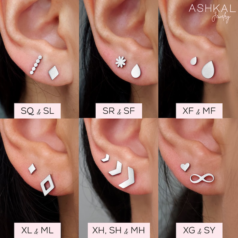 May include: Six different pairs of silver earrings, each pair featuring a unique design. The earrings are displayed on a model's earlobes. The designs include a row of small circles, a diamond, a flower, a teardrop, a small circle, a larger teardrop, a diamond, a chevron, a heart, and an infinity symbol.