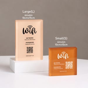 May include: Two rectangular acrylic WiFi signs in peach and orange tones. The large sign measures 4in x 6in, and the small sign measures 4in x 4in. Both feature the text WiFi, Network Welcome Boutique, Password HappyShopping, a QR code, and ERIKAGIFTCO.