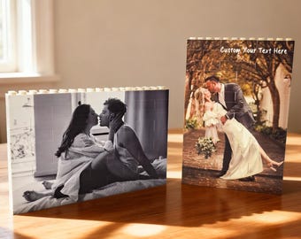 May include: Two custom photo puzzles. One is a black and white image of a couple kissing. The other is a color image of a couple kissing, with the text "Custom Your Text Here" at the top. Both puzzles are on a wooden surface.