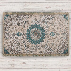 Gifts for Cat Lover Rectangular rug with an ornate floral design in cream, teal, and brown. The rug features a central teal medallion and a border with a similar colour scheme. The pattern is detailed and intricate, suitable for home decor.