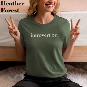 introvert on tee, minimalist text shirt, simple typography tee, aesthetic graphic tshirt, clean design streetwear, lowercase font design