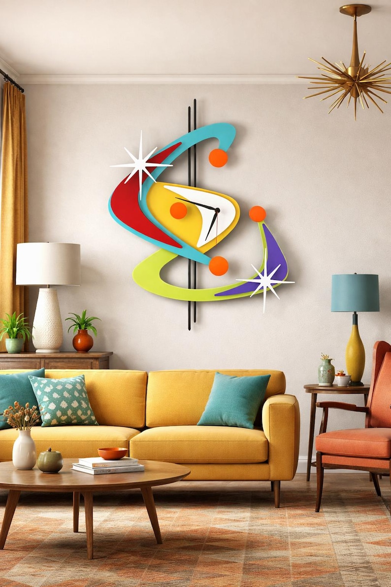 May include: A vibrant, mid-century modern wall clock with a distinctive boomerang shape. The clock has a white face, black hands, and is decorated with red, yellow, blue, green, and purple elements. Orange spheres and starbursts complete the design.