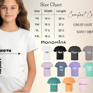 May include: A young person wearing a white t-shirt, with a size chart and color options for youth t-shirts. The chart shows sizes YS (14.5" width, 20.5" length) to YXL (19.5" width, 26.5" length). Colors include white, black, grey, and others.