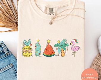 Comfort Colors® Christmas in July Shirt, Tropical Holiday Tee, Summer Flamingo Shirt, Cute Santa Beach Shirt, Coastal Xmas Shirt