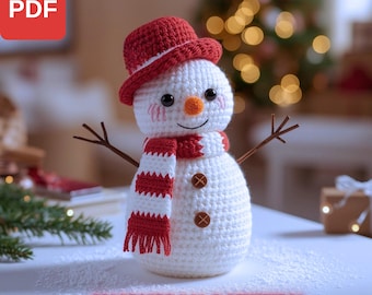 May include: A crocheted snowman with a red hat and scarf, brown twig arms, and button details. The snowman has a carrot nose and rosy cheeks. The text "SNOWMAN PATTERN" is at the bottom. The PDF icon is in the top left corner.