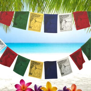 May include: A string of colorful prayer flags against a tropical beach backdrop. The flags are red, green, yellow, blue, and white, with illustrations of elephants and other designs. The scene includes palm fronds, flowers, sand, and ocean.