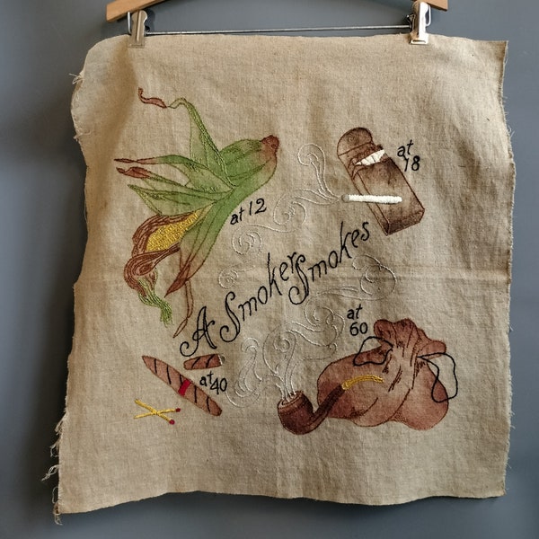 folk art 1900s "a smoker smokes" hand-embroidered panel, edwardian floss on printed linen. pillow cover or frameable art